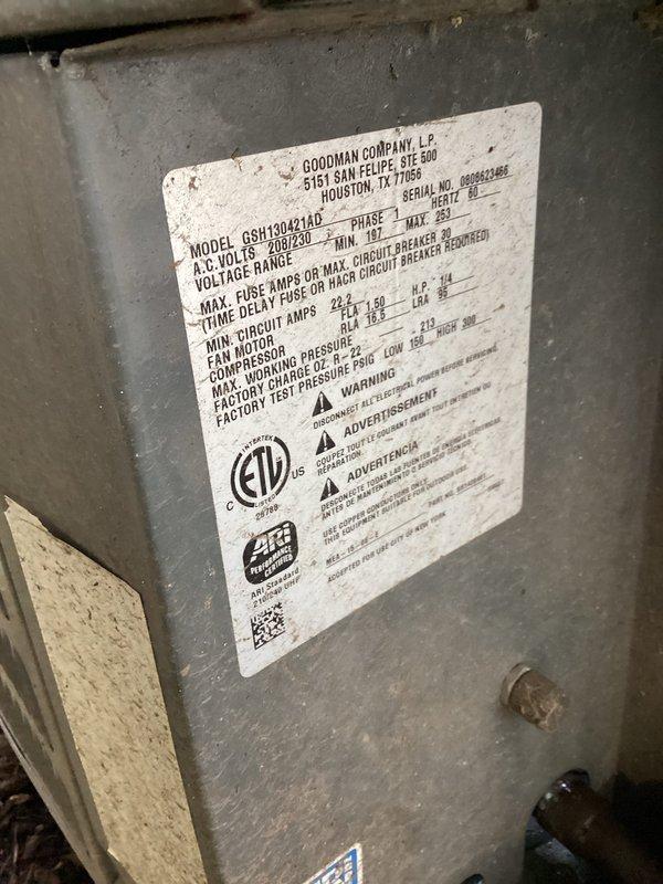 Performed diagnostic evaluation on 18-year-old Goodman split system air conditioning unit with outdoor condenser and high-ceiling garage air handler installation. System exhibited symptoms consistent with low refrigerant charge, requiring assessment of cooling performance and potential leak detection for the elevated air handler unit mounted at approximately 14 feet.