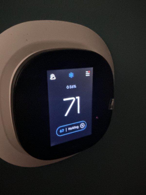 Completed annual Comfort Care maintenance on residential cooling system, including comprehensive inspection of control unit electronics and circuit boards. Verified thermostat operation at 71°F set point with 54% humidity reading and confirmed system holding temperature at 69°F. Inspected washable filter and advised customer to clean per maintenance schedule.