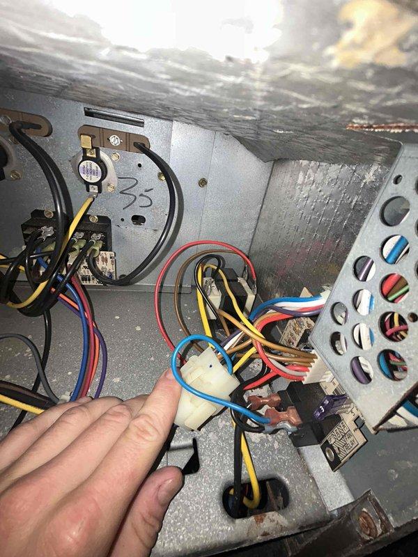 Responded to no cooling complaint on one of two residential air conditioning units. Upon inspection, found electrical connections requiring attention and observed significant rust and corrosion on interior metal surfaces of air handler, along with dirty evaporator coil and accumulated debris within ductwork. Documented system condition with photos showing deteriorated components, moisture damage, and maintenance needs for future reference.