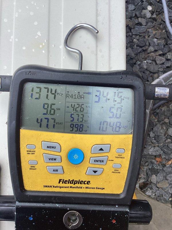 Responded to cooling inadequacy complaint where system only achieved 3-degree temperature drop after several hours of operation. Upon arrival, connected manifold gauges and performed complete system diagnostics on R410A unit. System pressures and temperatures indicated low refrigerant charge. Added refrigerant to manufacturer specifications under warranty coverage and injected leak sealant into system to address potential minor refrigerant loss. Monitored system performance and verified proper subcooling and superheat readings post-service.