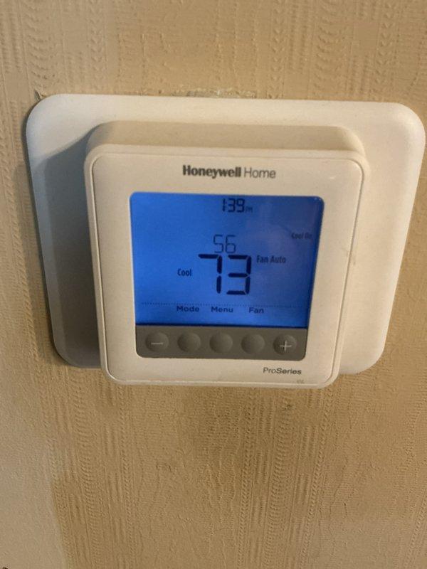 Completed monthly Comfort Care maintenance on cooling system, including basic cooling visit procedures. Verified thermostat operation showing 73°F set point with system in cooling mode and auto fan setting, replaced two 16x20x1 air filters, and documented system performance with photos confirming proper temperature control and equipment functionality.