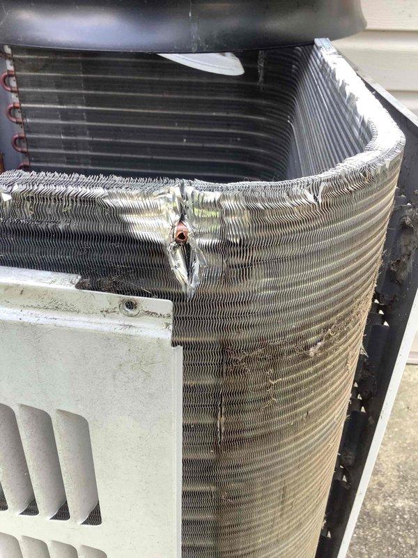 Responded to no-start condition on residential air conditioning system. Upon inspection, discovered significant mechanical damage to condenser coil fins with large compressed section in heat exchanger assembly, likely caused by screw penetration through coil. Documented extensive coil damage affecting system operation and provided assessment of required repairs.
