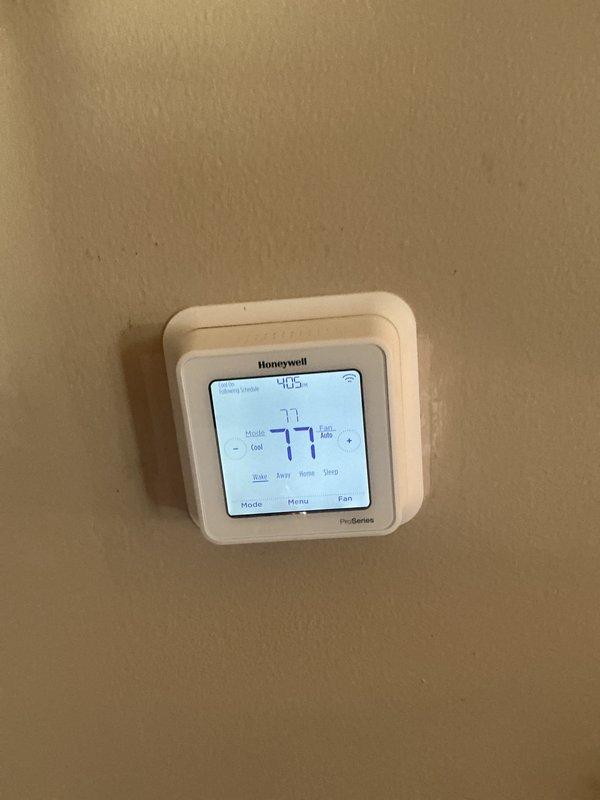 Completed basic monthly maintenance on CCHP cooling system. Performed standard inspection of thermostat operation, verified cooling setpoint at 77 degrees, and checked programming functionality. Accessed condensing unit, inspected electrical components including capacitor and control board, verified all wire connections were secure, and confirmed system operational status. Filter size 20x20x4 not included in this service visit.