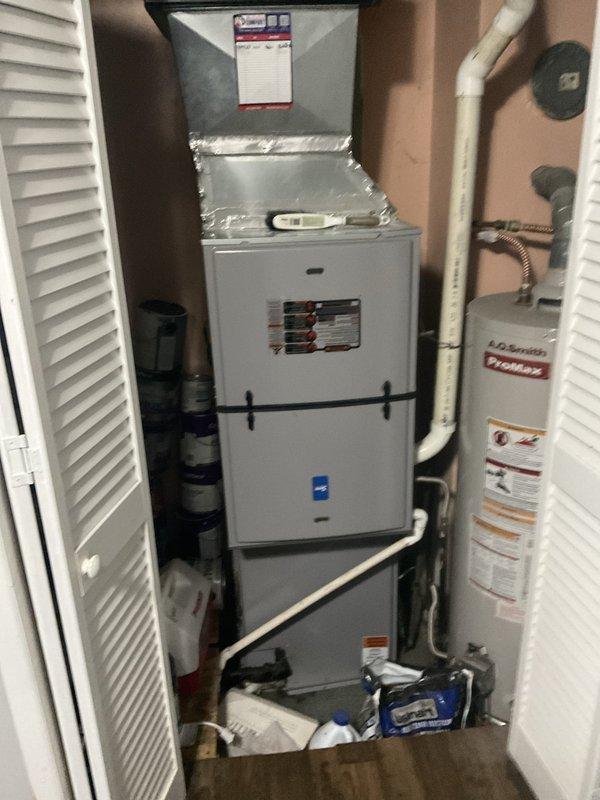 Responded to service call for air conditioning system experiencing compressor lockout due to thermal overload protection. Upon inspection, determined outdoor condensing unit is installed beneath an awning from previous installation, restricting adequate airflow and causing unit to overheat and shut down on safety controls. Evaluated existing indoor air handler and furnace configuration located in utility closet with associated ductwork and condensate drainage system. Provided comprehensive replacement system options and discussed available financing programs to address the inadequate outdoor unit placement and restore proper cooling system operation.