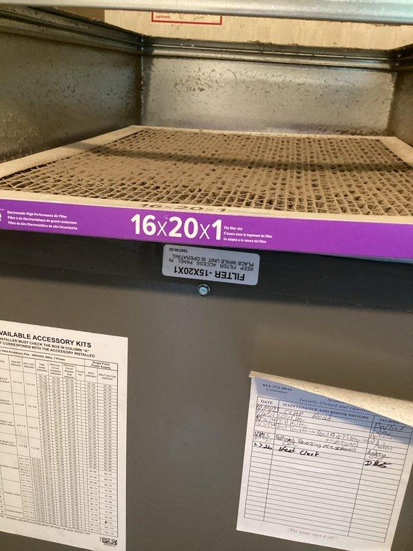 Completed basic monthly cooling maintenance visit on residential HVAC system. Verified thermostat operation showing system in auto mode at 68°F with 88% humidity reading, confirmed wireless connectivity and proper display function. Inspected air filter measuring 16x20x1 with purple border currently installed in unit, noted filter dimensions do not match standard 20x20x4 specification for this system, and documented existing service records and accessory kit information posted inside unit compartment.