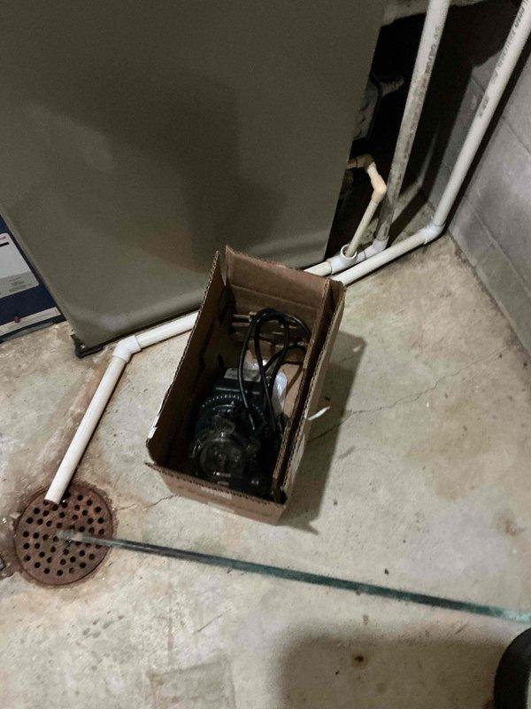 # Sump Pump Replacement

Replaced failed sump pump unit in basement utility area. Removed old pump assembly from pit and installed new pump with check valve and discharge piping. Verified proper float operation and tested pump cycle to ensure adequate drainage function. System operational and draining effectively.