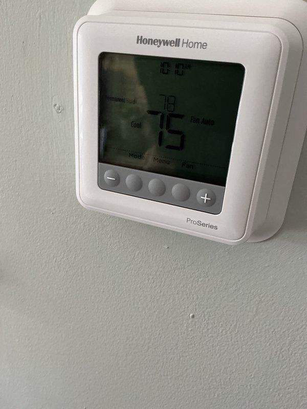 Completed annual cooling maintenance on two HVAC systems at residential property. Performed comprehensive inspections of both outdoor condenser units, checking refrigerant levels, electrical connections, and compressor operation. Verified proper airflow across condenser coils, inspected fan motor operation, and tested electrical disconnect boxes. Inside, evaluated Honeywell Home ProSeries thermostat functionality, confirming accurate temperature readings and proper communication with both systems. Checked thermostat settings showing cooling mode at 78°F with setpoint of 73°F and fan set to auto operation. Inspected refrigerant line sets and verified proper insulation on both systems. All equipment operating within normal parameters with no deficiencies noted. Both systems cooling effectively and ready for continued seasonal operation.