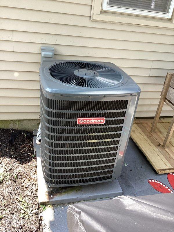 # HVAC Maintenance - Cooling System Service

Completed basic monthly cooling maintenance visit on Goodman residential air conditioning system. Performed electrical diagnostics using digital multimeter, recording voltage reading of 4258 on system components. Tested electrical connections and capacitor performance within the condenser unit's control panel, verifying proper operation of all wiring connections including power and control circuits.

Inspected outdoor condenser unit positioned on concrete pad. Verified proper airflow through horizontal fin assembly and protective grille. Confirmed unit operational status with no visible damage or deterioration to external components. All electrical conduit and refrigerant line protection verified secure along exterior mounting.

System operating within normal parameters. No immediate repairs required at this time.