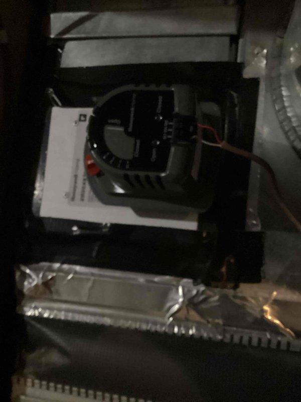Returned to property to replace malfunctioning zone damper in HVAC system. Removed defective damper assembly and installed new Honeywell zone damper with motorized actuator. Verified proper operation of damper motor, confirmed red indicator light functioning correctly, and tested zone control response to thermostat signals.