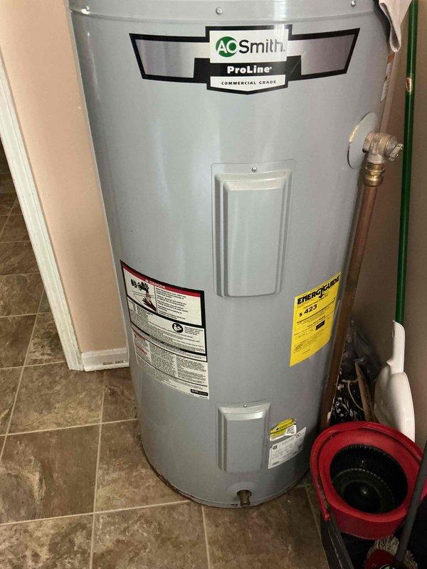 Responded to no hot water complaint affecting entire household. Upon arrival, inspected existing 25-year-old AO Smith ProLine tank water heater that had reached end of service life. Removed and disposed of failed unit. Installed new residential tank water heater with proper copper piping connections, temperature and pressure relief valve, and shut-off valves. Verified all plumbing connections for leaks, tested unit operation, and confirmed hot water restoration throughout home.