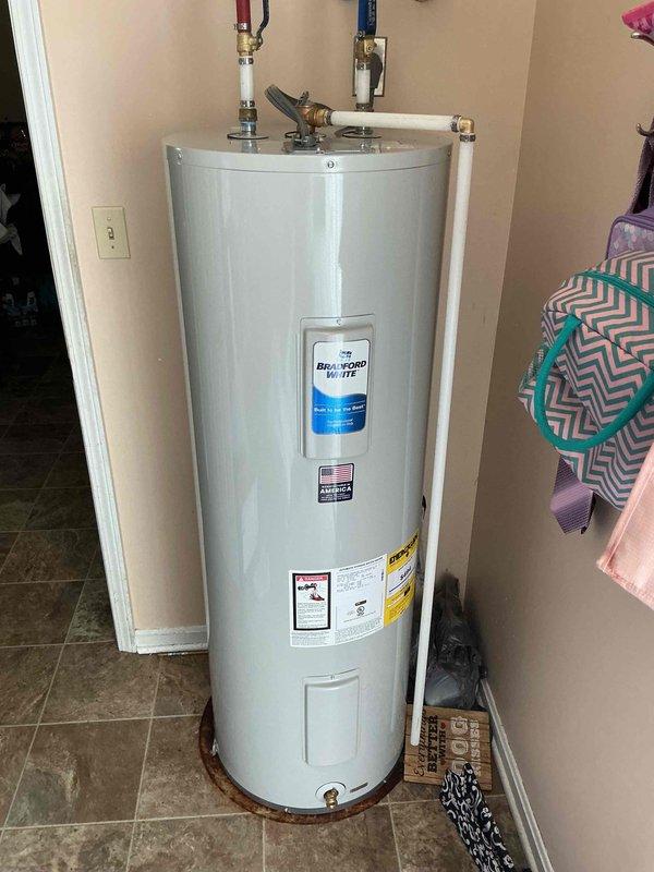 Responded to no hot water complaint affecting entire household. Upon arrival, inspected existing 25-year-old AO Smith ProLine tank water heater that had reached end of service life. Removed and disposed of failed unit. Installed new residential tank water heater with proper copper piping connections, temperature and pressure relief valve, and shut-off valves. Verified all plumbing connections for leaks, tested unit operation, and confirmed hot water restoration throughout home.