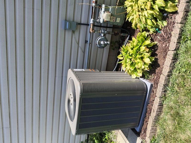 Completed installation of new Lennox air conditioning system with matching evaporator coil at residential property. Unit was properly positioned on concrete pad, electrical connections were verified with non-contact voltage tester, and disconnect box was installed per code requirements. System was tested and confirmed operational with all components functioning within manufacturer specifications.