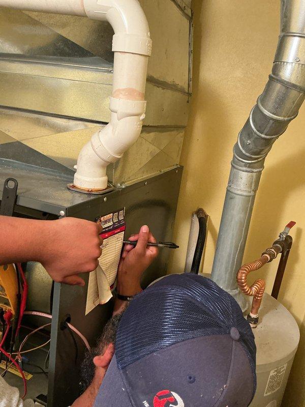 Completed basic monthly cooling maintenance visit on residential HVAC system located in mechanical room alongside water heater. Performed standard inspection procedures, verified system specifications from manufacturer label, checked refrigerant lines and ductwork connections, replaced 20x20x1 air filter, and confirmed thermostat operation displaying 74°F in heating mode. All equipment found operating within normal parameters with no issues identified during this recurring service visit.