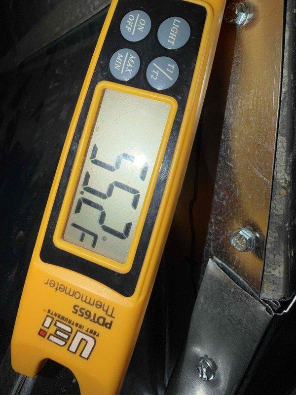 Completed installation of Lennox air conditioning system with matching evaporator coil. Installed and configured Lennox iLAQ smart thermostat (Model 32V51) with proper wiring and wall mounting. Verified system operation and confirmed temperature readings at 57.2°F, indicating proper cooling performance and successful startup of the new equipment.