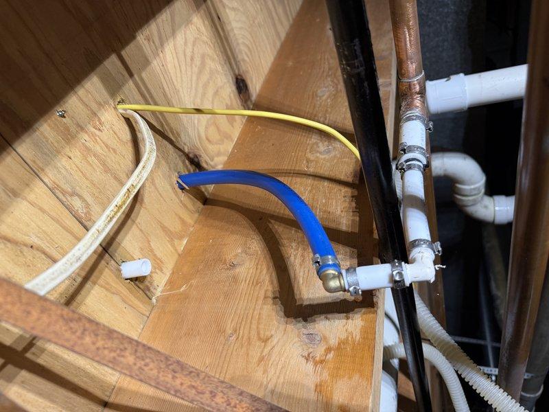 Relocated dishwasher shut-off valve approximately one foot to accommodate new appliance installation. Accessed existing plumbing through cabinet cavity, extended supply line using braided stainless steel connector, and secured new valve position to meet clearance requirements for replacement dishwasher unit.