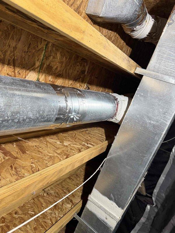 Completed HVAC system installation by connecting fresh air intake ductwork to the main system through attic and crawl space areas. Installed dampers in all supply lines to ensure proper airflow distribution and zone control throughout the structure, with all ductwork properly secured to floor joists using metal hangers and brackets.