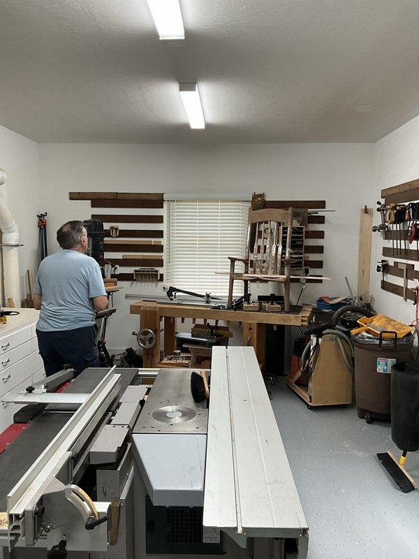 Conducted on-site evaluation for mini split installation in converted residential workshop space. Assessed room layout, electrical requirements, and optimal placement for indoor and outdoor units to provide climate control for active woodworking area with existing tool storage systems and equipment.