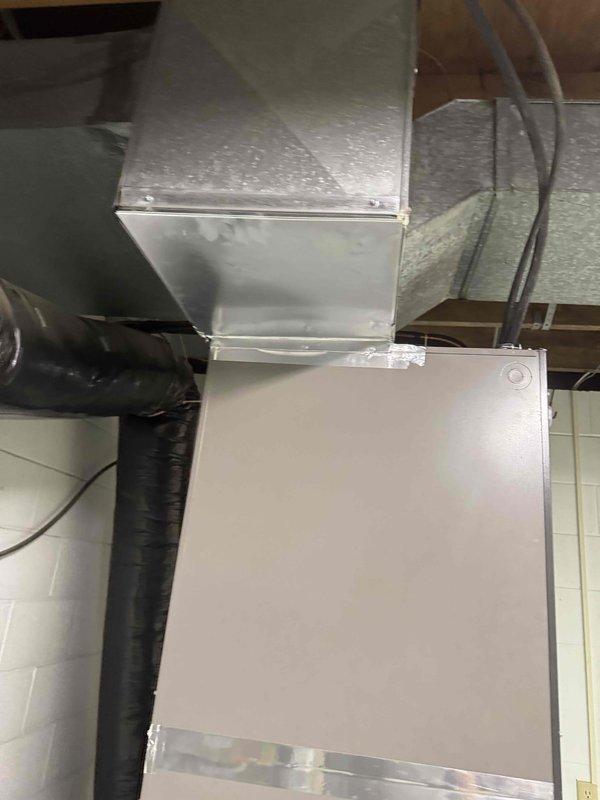 Completed full Lennox heat pump system installation including air handler unit mounted on basement wall with proper electrical connections and condensate drainage via PVC piping. Installed ductwork distribution system in attic space with rigid rectangular trunk line and flexible branch ducts, secured air handler unit in attic with reflective foil-faced insulation surrounding installation area. System tested and verified operational with all refrigerant lines, electrical connections, and condensate drainage functioning properly.