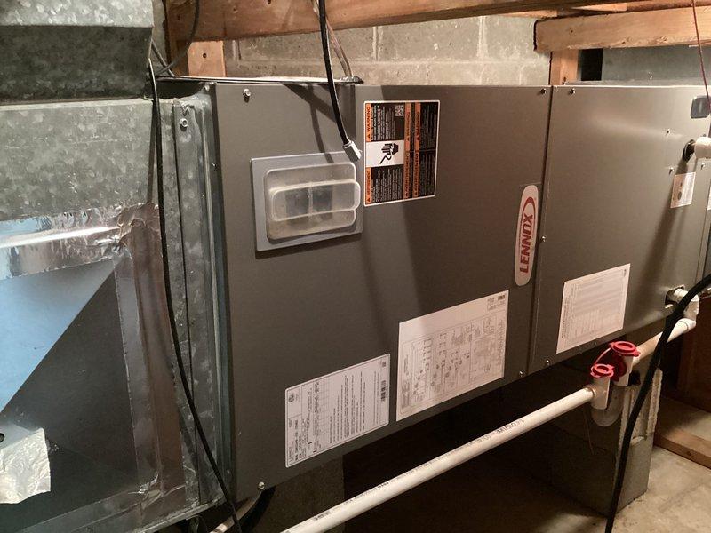 Completed comprehensive cooling maintenance on Lennox HVAC system. Performed system diagnostics using digital multimeter, recording temperature differential readings of 79.9°F and 21.6°F to verify proper cooling operation and refrigerant charge. Inspected all electrical connections, condensate drain lines, and PVC plumbing components with red-handled shutoff valves for proper operation. System operating within manufacturer specifications upon completion of preventive maintenance service.