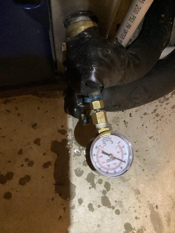 Installed loop conditioner on hydronic heating system with proper pressure monitoring equipment. Added pressure gauge to brass fittings on insulated black piping to monitor system parameters and ensure optimal operation. Verified all connections secure and system pressurized to manufacturer specifications.