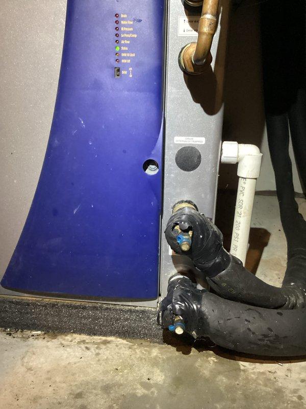 Installed loop conditioner on hydronic heating system with proper pressure monitoring equipment. Added pressure gauge to brass fittings on insulated black piping to monitor system parameters and ensure optimal operation. Verified all connections secure and system pressurized to manufacturer specifications.