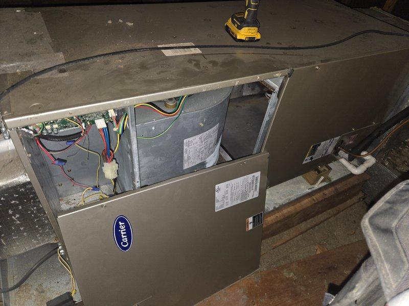 # HVAC Service Completed

Responded to no cooling complaint on 10-year-old Carrier air conditioning system. Upon arrival, conducted diagnostic assessment of unit located in basement mechanical room.

Removed access panel to inspect internal components and electrical systems. Observed multiple system fault events logged in thermostat control, including communication errors and motor fault codes. Diagnostic screen revealed pattern of recurring faults indicating control board or motor communication issues.

Performed comprehensive system evaluation including visual inspection of circuit board, wiring connections, and blower motor assembly. Checked refrigerant line connections and verified proper electrical supply to unit. Examined control wiring between thermostat and air handler for loose connections or damage.

Reviewed fault history showing multiple communication and motor fault events, suggesting potential failure of control board, blower motor, or wiring harness. Based on age of equi