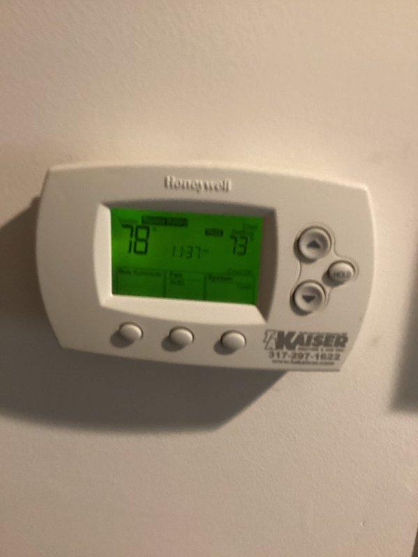 Responded to no cooling complaint where thermostat was set to 72°F but indoor temperature remained in the 90s. Upon arrival, found thermostat displaying 78°F set point with actual room temperature reading of 93°F. Inspected outdoor condensing unit and confirmed equipment appeared in normal operating condition with no visible damage or deterioration to housing, coils, or fan assembly. Unit was properly positioned on concrete pad with intact electrical connections and conduit. Completed diagnostic evaluation of system performance and addressed cooling deficiency to restore proper operation.