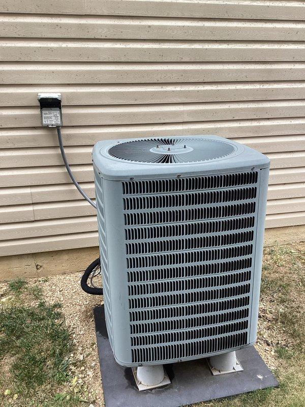 Responded to no cooling complaint where thermostat was set to 72°F but indoor temperature remained in the 90s. Upon arrival, found thermostat displaying 78°F set point with actual room temperature reading of 93°F. Inspected outdoor condensing unit and confirmed equipment appeared in normal operating condition with no visible damage or deterioration to housing, coils, or fan assembly. Unit was properly positioned on concrete pad with intact electrical connections and conduit. Completed diagnostic evaluation of system performance and addressed cooling deficiency to restore proper operation.