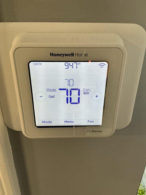 Completed preventative maintenance on residential cooling system. Performed standard inspection of HVAC equipment, verified thermostat operation showing system cooling to setpoint of 70°F, and included replacement air filter as part of service agreement obligation.