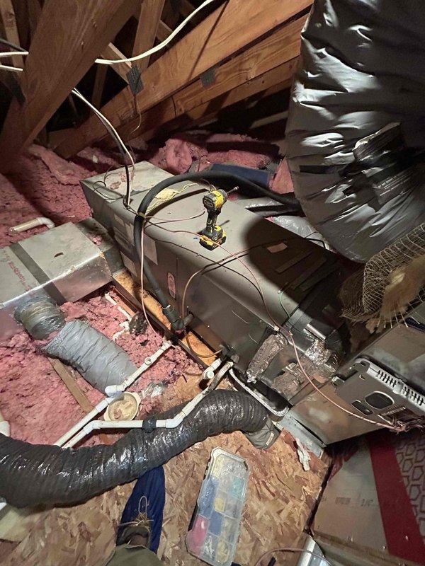 Completed thermostat installation in attic-mounted HVAC system. Installed new thermostat control wiring between air handler unit and heating/cooling equipment, verified proper connections to control board, and tested system operation to ensure proper communication between thermostat and HVAC components.