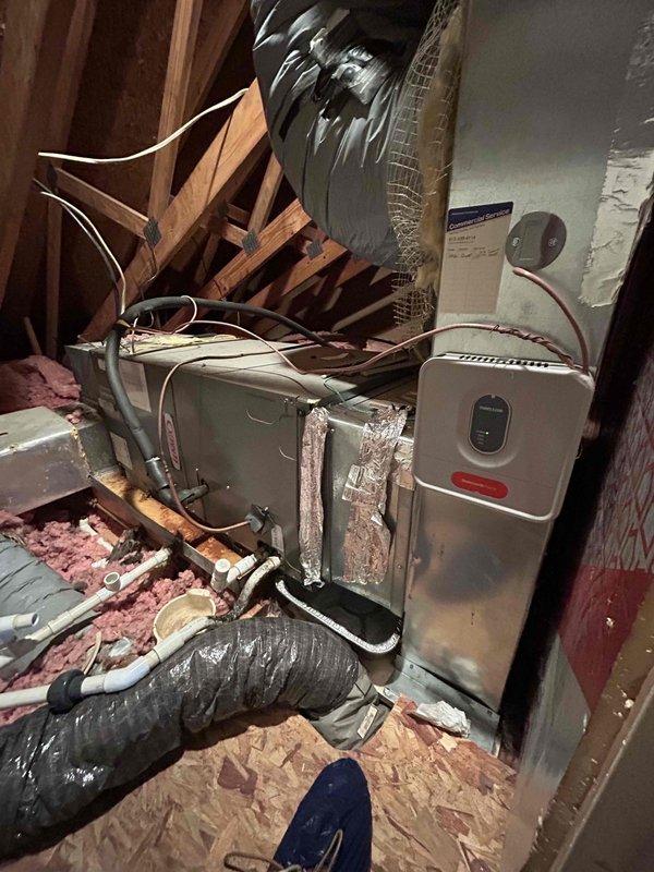 Completed thermostat installation in attic-mounted HVAC system. Installed new thermostat control wiring between air handler unit and heating/cooling equipment, verified proper connections to control board, and tested system operation to ensure proper communication between thermostat and HVAC components.