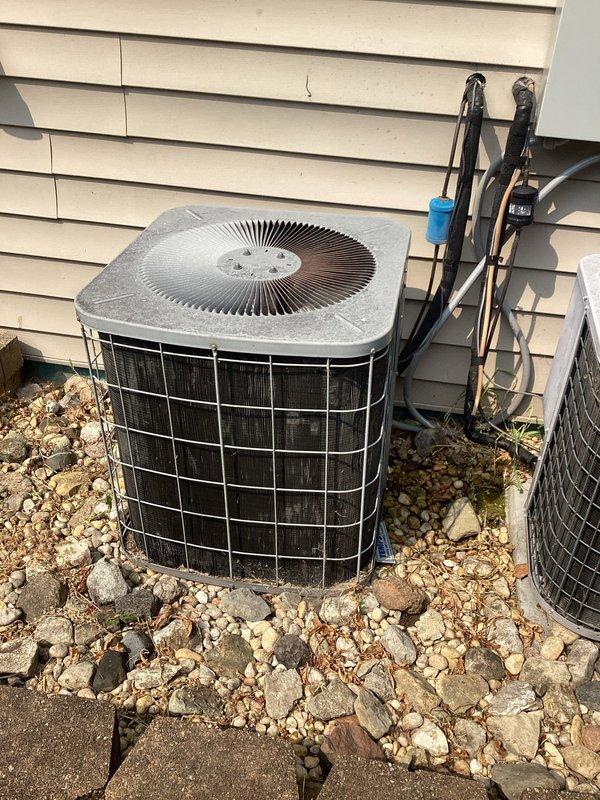 Responded to service call for air conditioning system blowing warm air at recently occupied residence. Performed diagnostic inspection of outdoor condenser unit and indoor air handler system. Conducted visual assessment of refrigerant lines, electrical connections, and overall system operation to identify cause of inadequate cooling performance. Documented equipment condition with photographs for service records.