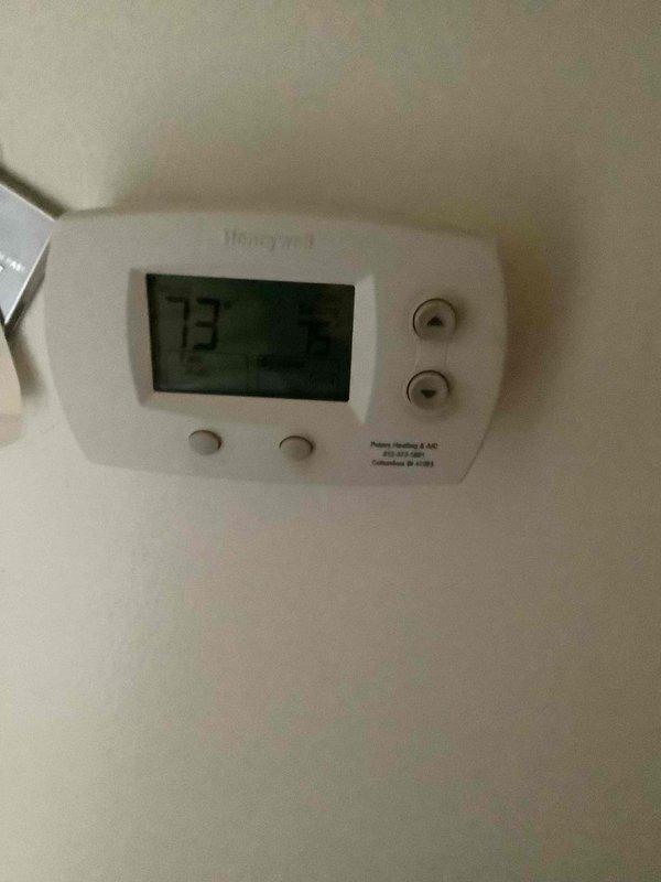 Completed basic monthly cooling maintenance visit on residential HVAC system. Inspected and verified proper operation of thermostat displaying 73°F, checked ceiling-mounted supply register for adequate airflow, and replaced 14x20x1 air filter. System operating within normal parameters with no issues identified.