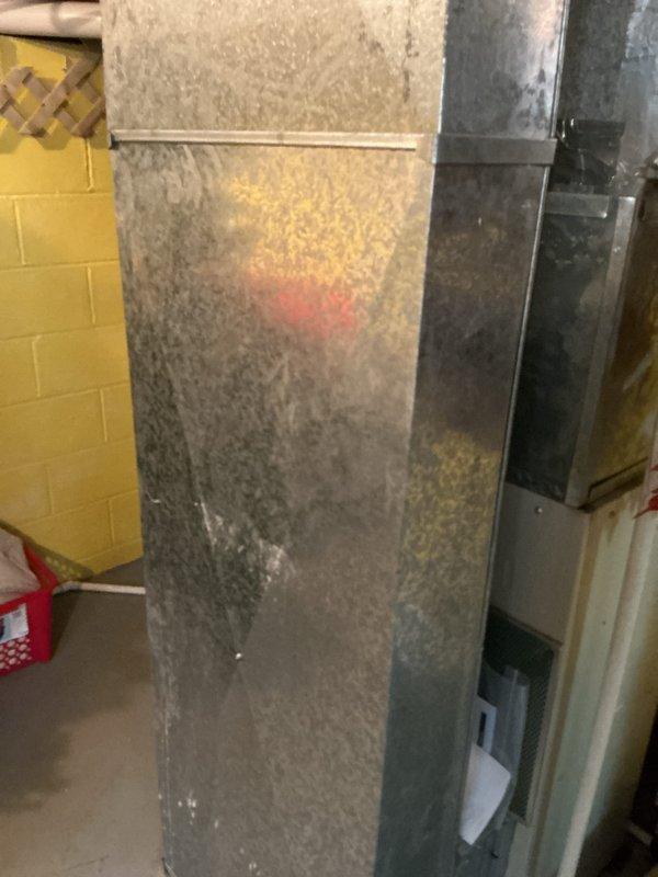 Completed basic cooling maintenance visit on residential HVAC system located in basement mechanical room. Inspected vertical air handler unit and furnace assembly, noting significant dust accumulation on exterior panels and surfaces. Provided 16x25x1 filter as part of routine maintenance protocol.