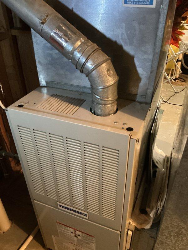 Completed basic cooling maintenance visit on residential HVAC system located in basement mechanical room. Inspected vertical air handler unit and furnace assembly, noting significant dust accumulation on exterior panels and surfaces. Provided 16x25x1 filter as part of routine maintenance protocol.