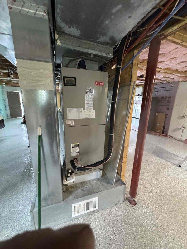 Relocated existing refrigerant line set, main electrical supply, and thermostat wiring to accommodate new HVAC air handler positioning in basement mechanical room. Successfully reused all existing materials including copper refrigerant lines, electrical conductors, and low-voltage control wiring, rerouting through exposed joist space to new equipment location. Unit installed on concrete pad with proper clearances, all connections secured and tested for proper operation.