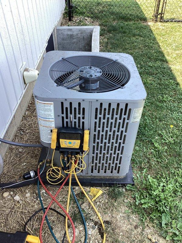 Responded to service call for Trane outdoor condensing unit. Upon arrival, connected manifold gauge set to service ports to diagnose compressor failure on unit model #1001120. Verified compressor was not operating and confirmed need for replacement. Removed failed compressor assembly part #250497315-101 and installed new OEM replacement compressor. Evacuated system to proper vacuum levels, recharged with manufacturer-specified refrigerant, and performed operational testing to verify proper system function and pressures.