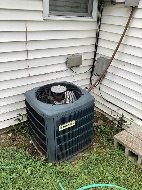 Responded to service call for Guardian system not producing cold air. Upon arrival, verified thermostat displaying 86°F with system running but no cooling. Inspected outdoor condenser unit and found compressor not engaging while fan motor operating normally. Checked electrical connections at disconnect and confirmed proper voltage supply. Diagnosed failed run capacitor preventing compressor from starting. Replaced defective dual run capacitor with OEM equivalent rated at proper microfarad specifications. Tested system operation and confirmed compressor engaging properly with normal amp draw. Verified cold air delivery at supply registers and proper temperature differential across evaporator coil. System restored to normal cooling operation.