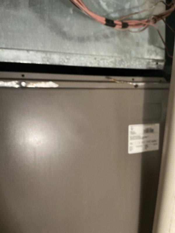 Responded to warranty callback for disconnected supply trunk line at indoor air handler unit. Upon inspection, confirmed supply ductwork had separated from evaporator coil connection point. Properly reconnected and secured supply trunk line to evaporator coil housing, ensuring proper seal and airflow path. System tested and verified operational with restored air distribution.