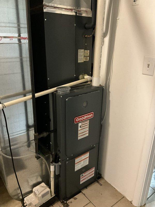 Conducted comprehensive estimate for complete HVAC system replacement involving new air conditioning unit and furnace installation. Assessed existing Goodman furnace setup in basement utility area, evaluated current ductwork configuration, PVC condensate drainage system, and electrical connections to determine scope of replacement work. Documented equipment specifications, installation space constraints, and necessary modifications to accommodate new high-efficiency heating and cooling system.