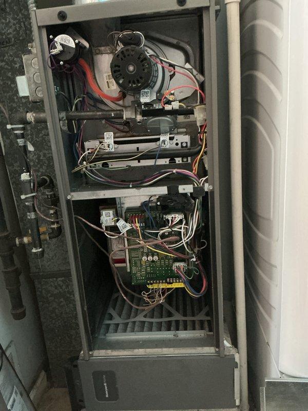 Completed basic monthly cooling maintenance on HVAC system. Performed comprehensive system inspection including interior air handler components with blower motor, capacitor, heat exchanger assembly, and control board, as well as exterior condensing unit electrical compartment with capacitor and contactor. Documented all equipment conditions with photos, confirmed proper wire connections throughout both units, and verified system operational status per standard maintenance protocol.