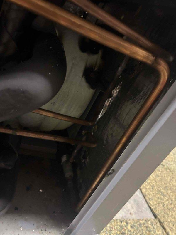 Returned to site to install domestic hot water coaxial heat exchanger on WaterFurnace geothermal unit. Accessed unit interior, installed DHW coax component, reconnected refrigerant lines and electrical connections, and verified proper operation of system upon completion.