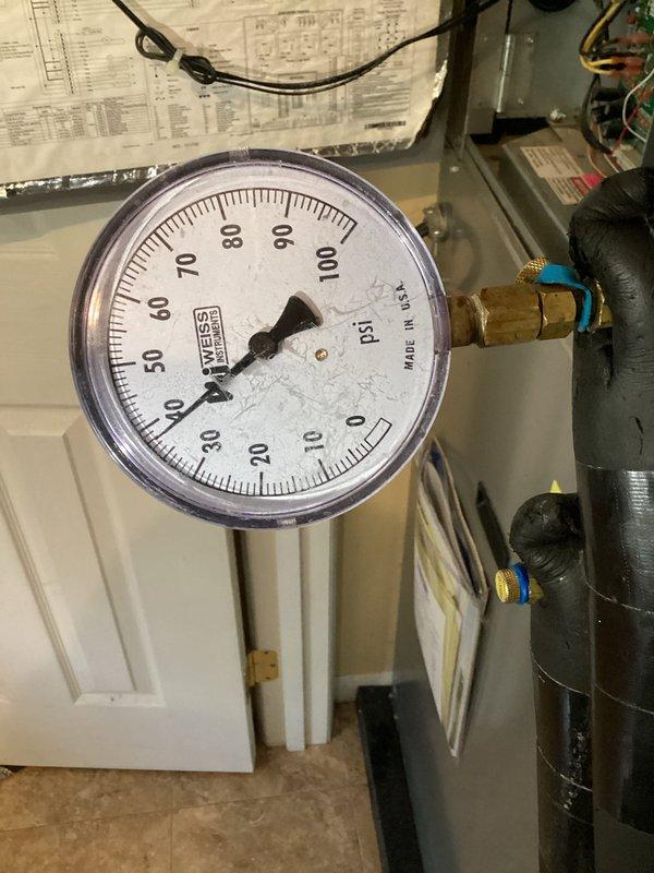 Performed diagnostic inspection on geothermal heat pump system, examining electrical control panel wiring and connections including Emerson Climate Technologies components and circuit boards. Monitored system pressures using gauge equipment to assess loop performance. Follow-up visit required to install loop conditioner pressure ports and retrieve geo needle cover left on-site from previous service call, with warranty information to be reviewed at that time.