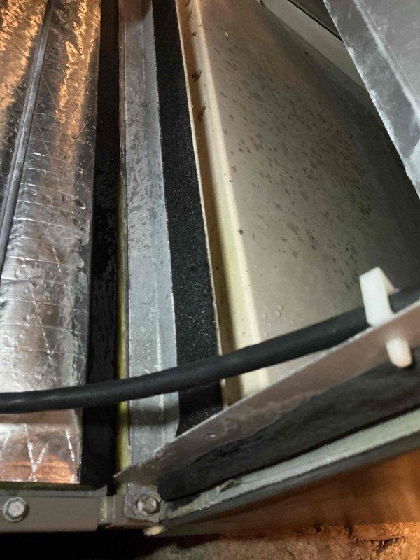 Responded to complaint of musty "dirty sock" odor emanating from A/C unit during initial operation lasting approximately 20 minutes. Performed scheduled maintenance inspection of system including evaporator coil assessment and ductwork evaluation in attic space. Installed new 20x25x4 air filter and documented condition of flexible ductwork, insulation, and air handler components showing normal dust accumulation consistent with system usage.
