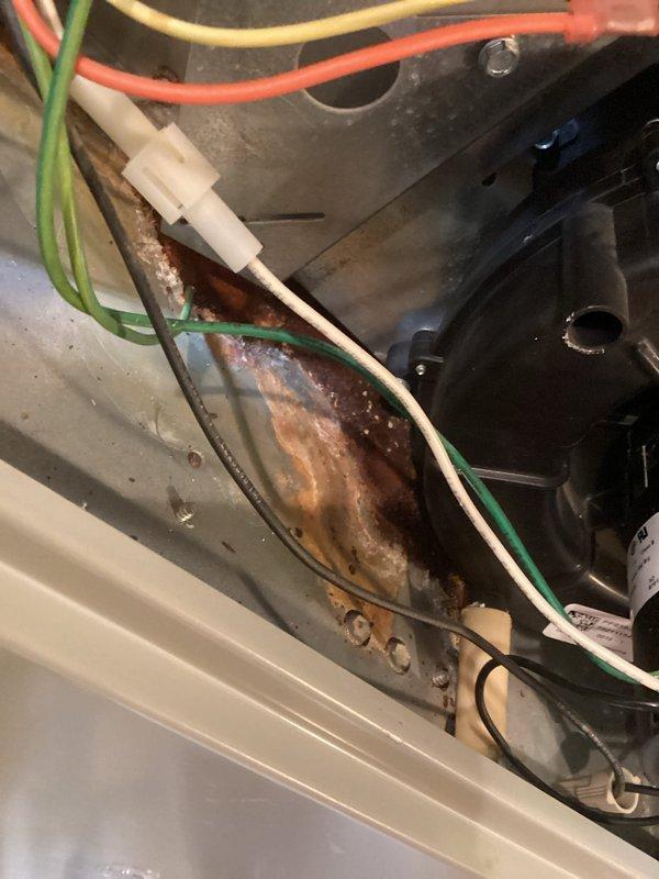 Responded to service call for 21-year-old Trane XB10 air conditioning system experiencing weak cooling throughout the residence. Upon inspection, found system operational but failing to maintain adequate cooling capacity. Documented significant corrosion on interior mounting components and wiring connections, indicating advanced deterioration consistent with unit age. Inspected existing thermostat controls and system wiring. Given the extensive age of the outdoor unit and visible internal corrosion affecting critical components, recommended full system replacement to restore proper cooling function and prevent imminent system failure.