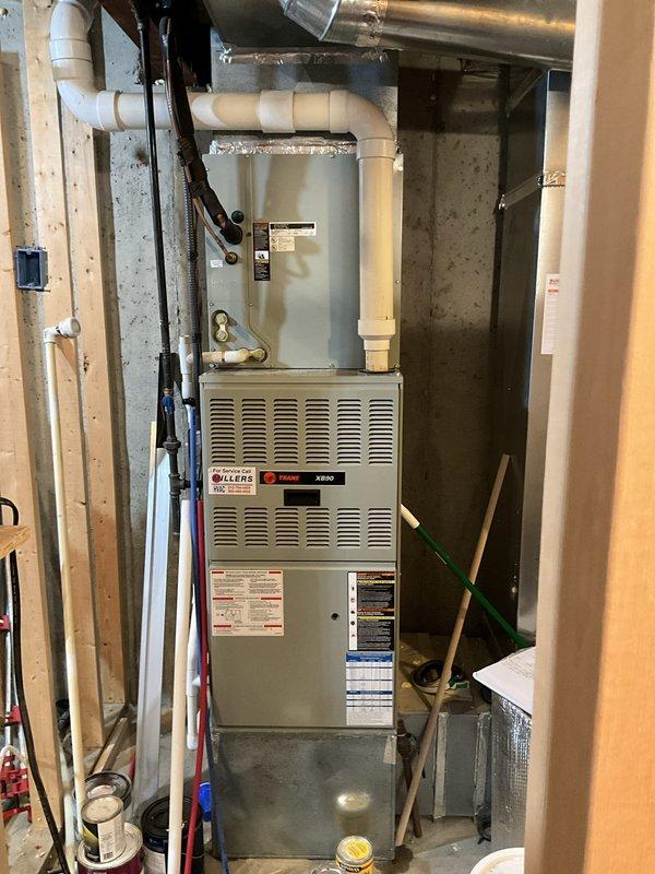 Completed HVAC system assessment for existing Trane XR80 furnace installation in residential basement utility area. Documented current equipment condition including forced air furnace unit, PVC ventilation and drainage system, ductwork configuration, and electrical connections. Prepared comprehensive replacement estimate for new HVAC unit based on observed system layout, existing infrastructure, and customer request following initial repair visit.