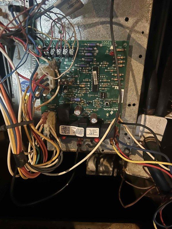 Replaced failed Emerson control board and thermostat on HVAC system. Disconnected all low-voltage wiring from original control board, removed defective board from furnace cabinet, installed new Emerson control board, and reconnected all thermostat and system wiring to proper terminals. Verified all wire connections secure and system operational upon completion.