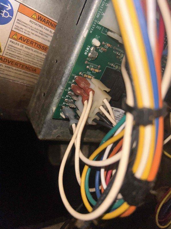 Replaced failed Emerson control board and thermostat on HVAC system. Disconnected all low-voltage wiring from original control board, removed defective board from furnace cabinet, installed new Emerson control board, and reconnected all thermostat and system wiring to proper terminals. Verified all wire connections secure and system operational upon completion.