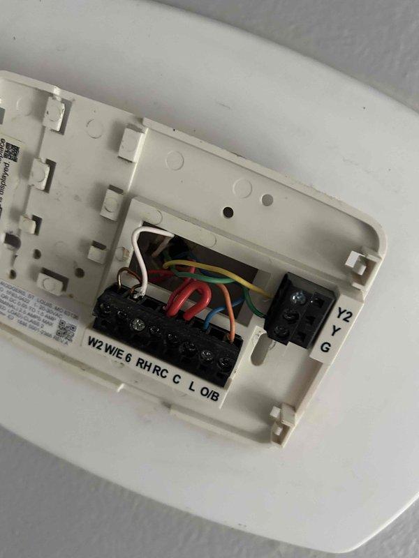 Responded to service call for thermostat malfunctioning with intermittent power cycling and switching from cooling to heating mode. Removed existing thermostat from wall, diagnosed wiring and connection issues, and installed customer-provided replacement thermostat. Verified proper terminal connections for all HVAC functions including heating, cooling, fan control, and common wire, then tested system operation to confirm proper functionality.