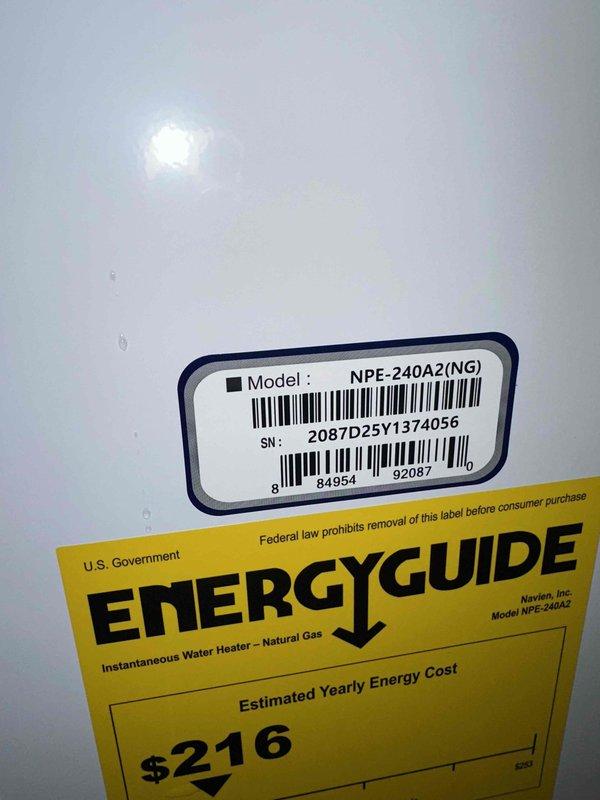 Responded to customer inquiries regarding Navien NPE-240A2 natural gas instantaneous water heater operation and specifications. Documented unit model and serial number information, confirmed EnergyGuide energy efficiency ratings, and verified proper functioning of wall-mounted control panel displaying temperature settings at 120°F and flow rate indicators.